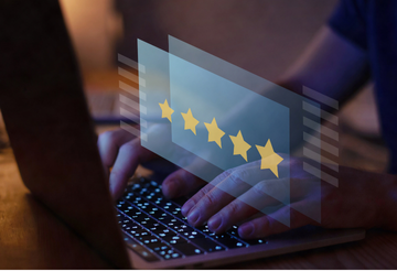 Image of a man writing a five star review
