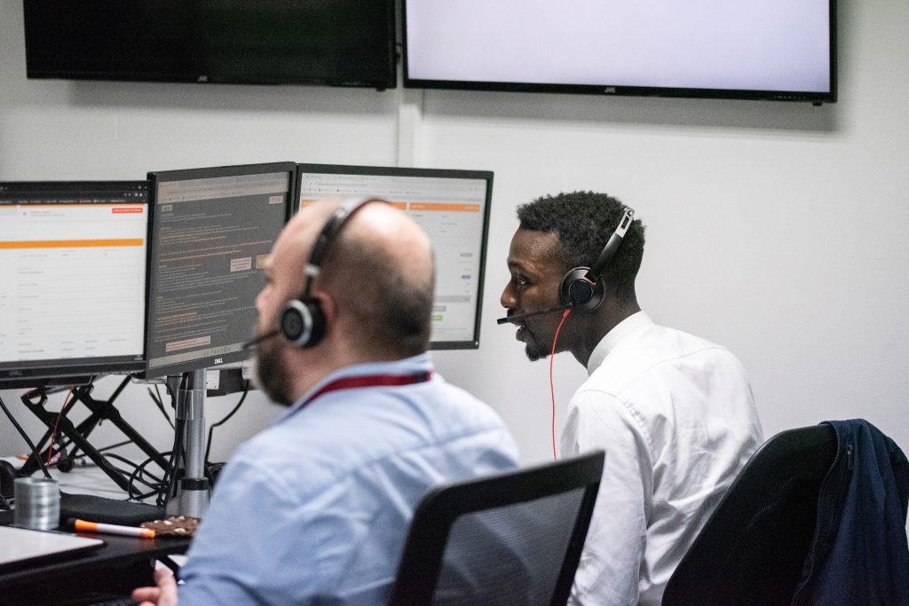 Image of 2 of our agents on the phone
