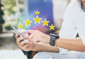 Image of 5 gold stars hovering above a mobile phone